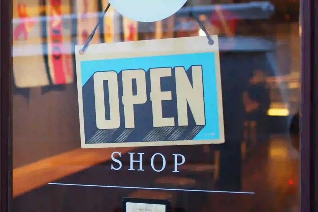 Storefront window with open sign.